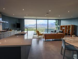 a kitchen and living room with a view of the mountains at Gillside in Keswick