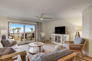 a living room with a couch and a tv at 608 Sailmaker in Fernandina Beach