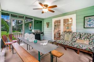 a living room with a couch and a table at 96097 Piney Island in Fernandina Beach
