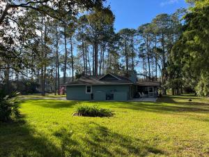 a house in the middle of a yard at 96097 Piney Island in Fernandina Beach