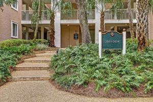 a walkway in front of a building with a sign at 2034 Beachwood in Fernandina Beach
