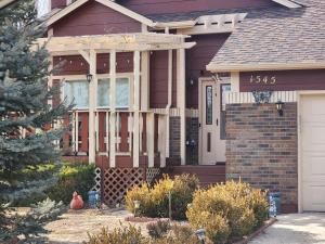 a house with a christmas tree in front of it at Colorado Cottage W/Mountain View in Colorado Springs