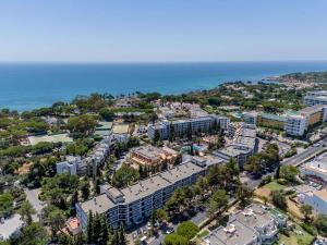 an aerial view of a city with the ocean at Studio on Maria Luisa Beach Wifi Parking Swimming Pool in Olhos de Água