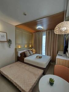 Ένα ή περισσότερα κρεβάτια σε δωμάτιο στο Near in Mactan Airport - eZEE escape just for you! +9 φωτογραφίες