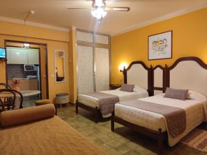 Ένα ή περισσότερα κρεβάτια σε δωμάτιο στο Apartamentos Turisticos Praia Grande +84 φωτογραφίες