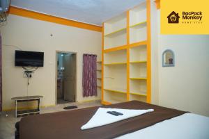 Postel nebo postele na pokoji v ubytování Bacpack Monkey HomeStay