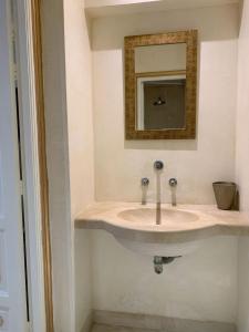 a bathroom with a sink and a mirror at Le luxe de Sidi Bou Saïd in Sidi Bou Saïd +35 photos