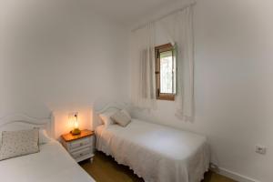 Ένα ή περισσότερα κρεβάτια σε δωμάτιο στο Villa Emilia