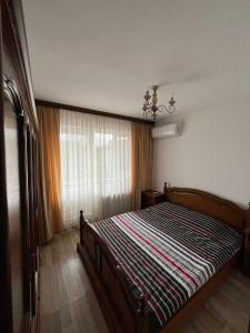 Ένα ή περισσότερα κρεβάτια σε δωμάτιο στο COM Home Tarnaveni