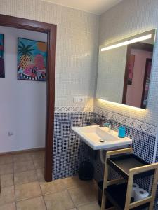 a bathroom with a sink and a mirror at Casalegre in Cotillo +46 photos