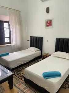 Postel nebo postele na pokoji v ubytování Riad Oussari