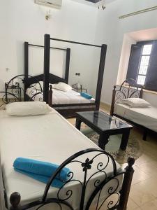 Postel nebo postele na pokoji v ubytování Riad Oussari