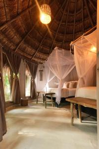 Postel nebo postele na pokoji v ubytování Art Village Tulum