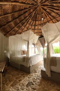 Postel nebo postele na pokoji v ubytování Art Village Tulum