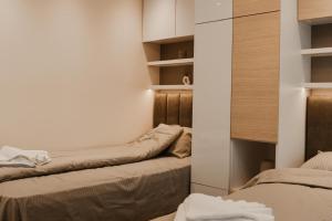 Apartmani "AS"客房内的一张或多张床位