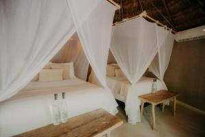 Postel nebo postele na pokoji v ubytování Art Village Tulum