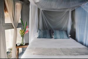 Postel nebo postele na pokoji v ubytování Art Village Tulum