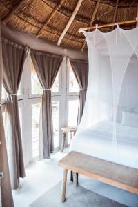 Postel nebo postele na pokoji v ubytování Art Village Tulum