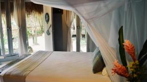 Postel nebo postele na pokoji v ubytování Art Village Tulum