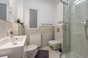 a bathroom with a sink and a toilet and a shower at Suite Apartment Hidden Gem next Synagogue - A in Budapest