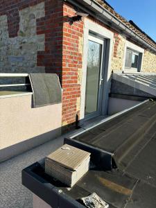 a roof of a house with a window and a roof at Chez MJ in Pont-à-Celles