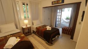 a small bedroom with a bed and a window at Centro Paulus in Sao Paulo +79 photos