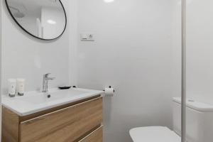 a bathroom with a sink and a mirror at ViVi Homes - Anemona , Beach , Balcony, Centre in Fuengirola