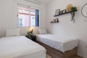 En eller flere senge i et værelse på ViVi Homes - Anemona , Beach , Balcony, Centre