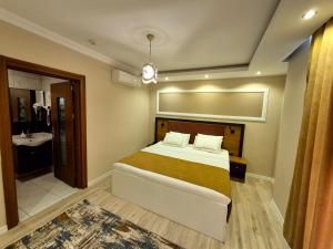 Postel nebo postele na pokoji v ubytování Toprak Apart Otel