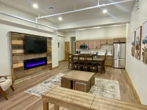a living room with a kitchen and a dining room at Luxury TownHome 106 in Wilmington