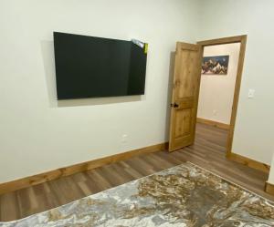 a living room with a flat screen tv on the wall at Luxury TownHome 106 in Wilmington