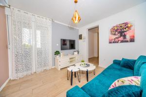 Televízia a/alebo spoločenská miestnosť v ubytovaní Split Apartment M&T