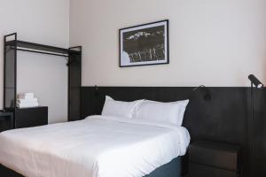 Cama ou camas em um quarto em Main By Babel