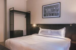 Cama ou camas em um quarto em Main By Babel