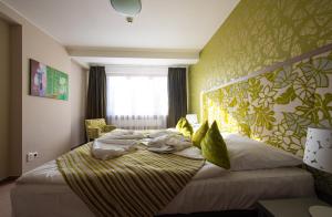 Posteľ alebo postele v izbe v ubytovaní Hotel Bystrá