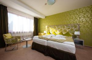 Posteľ alebo postele v izbe v ubytovaní Hotel Bystrá