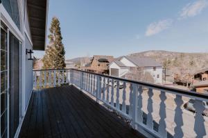 a balcony with a view of the mountains at Stylish Home with Hot Tub, Ping Pong, Pickleball, Electric Scooters and Pet Friendly in Big Bear City