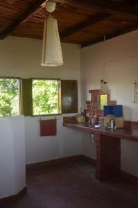 a kitchen with a counter top in a room at Casa del Mar - El Zanate in Las Peñitas