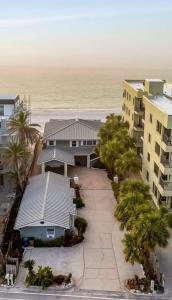 an aerial view of a house and the beach at Stones Throw Beachside Bungalow #1 ON THE BEACH in Clearwater Beach