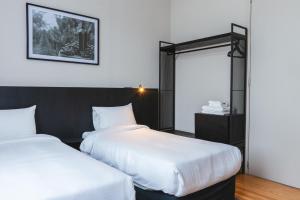 Cama ou camas em um quarto em Main By Babel