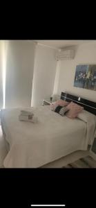 Postel nebo postele na pokoji v ubytování Apartamento en Rambla de Colonia + 13 fotografií