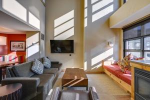 a living room with couches and a fireplace at Ski-InandSki-Out Park City Condo Fireplace and View! in Park City