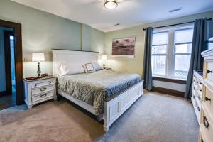 a bedroom with a bed and a dresser and a window at Sr Pilot Earhart Hangar Suite, 2 br K &Q, 1 Ba in Atchison