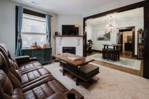 a living room with a couch and a fireplace at Sr Pilot Earhart Hangar Suite, 2 br K &Q, 1 Ba in Atchison