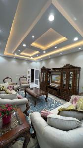a large living room with couches and a table at ليلتي الجميلة in Al Madinah