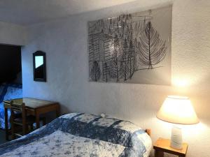 Ένα ή περισσότερα κρεβάτια σε δωμάτιο στο Résidence Herbouilly - Nouveauté: Joli 3pièces aux pieds des pistes MAE-3934