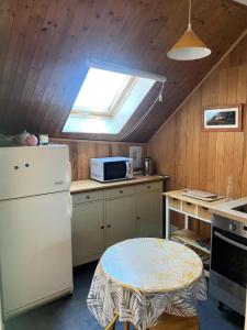 Kuchyňa alebo kuchynka v ubytovaní Résidence Maison Vercors - Nouveauté en plein coeur du Village Trois pièces MAE-3774