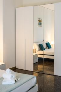 a bedroom with a bed and a mirrored closet at Laura Home in Verona +48 photos