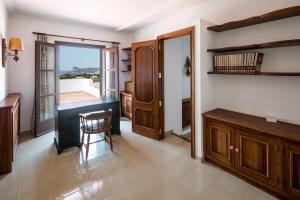 a room with a desk and a chair and a window at Villa Marlis Ibiza in IBZ +40 photos