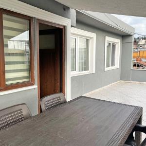 a table and chairs on a patio with a window at Elite Marmara Bosphorus & Suites in Istanbul